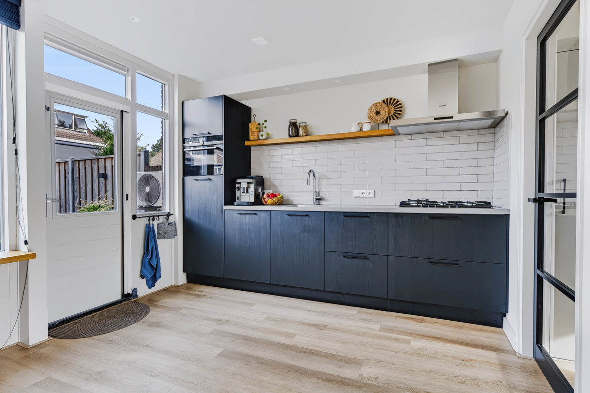 Tussenwoning te koop: Merelstraat 10, Vaassen